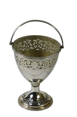 Lot 116 - A mid 18thC silver swing handled sugar basket,...
