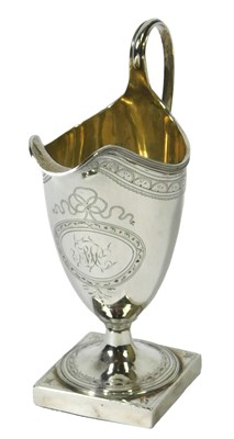 Lot 119 - A George III silver helmet shaped cream jug,...