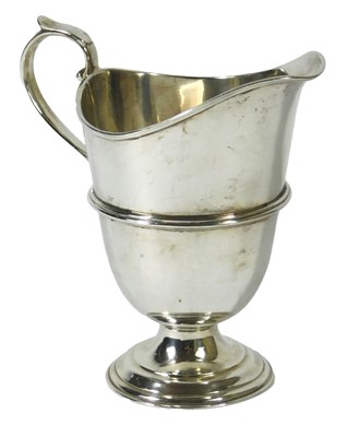 Lot 120 - A late Victorian silver helmet shaped cream...