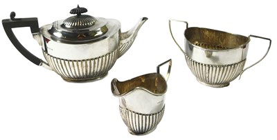 Lot 101 - An Edwardian silver three piece tea set, with...