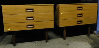 Lot 1134 - A pair of mid century teak light chests, each...