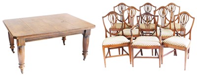 Lot 535 - A Victorian oak wind out dining table, with...