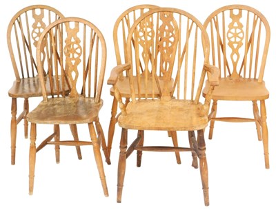 Lot 523 - A set of five Ercol style Windsor beech dining...