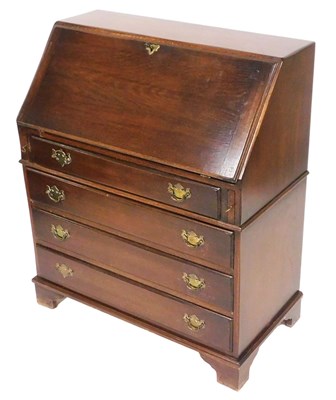Lot 526 - A Reprodux mahogany bureau, the fall flap...