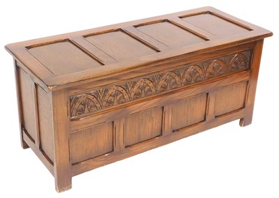 Lot 542 - An oak coffer, with a four panelled lid, above...