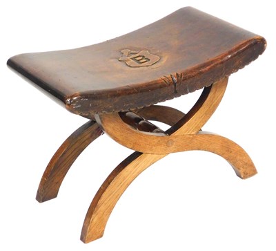 Lot 560 - An early 20thC Heraldic x frame stool, with a...