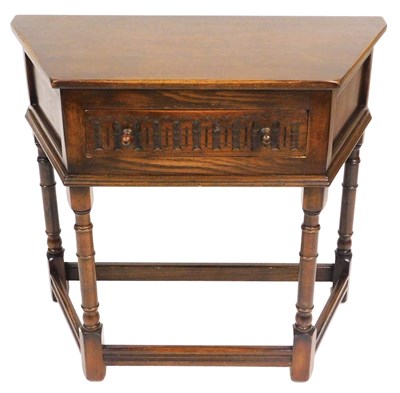 Lot 561 - An Old Charm style oak side table, with a...