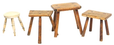 Lot 565 - Three oak and elm joint stools, and a beech...