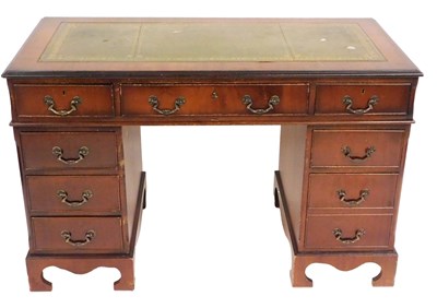 Lot 566 - A mahogany twin pedestal desk, with a gilt...