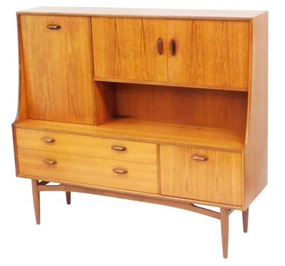 Lot 469 - A G-Plan teak sideboard, with a drinks cabinet...
