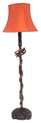 Lot 476 - A Chinese hardwood standard lamp, carved with...