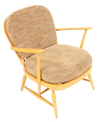 Lot 572 - An Ercol blonde elm armchair, model 334, with...