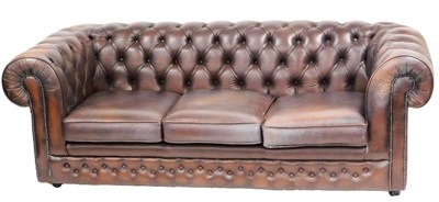 Lot 581 - A Thomas Lloyd brown leather three seater...