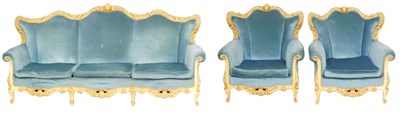 Lot 587 - A continental Baroque style cream and parcel...