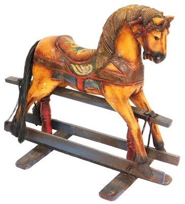 Lot 588 - A painted wooden rocking horse, with floral...