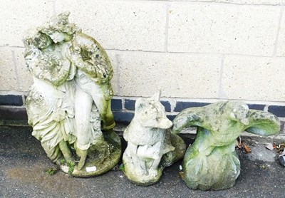 Lot 591 - A concrete garden sculpture, of two lovers in...