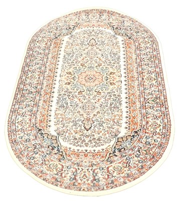 Lot 596 - A Turkish oval cream ground rug, with a...