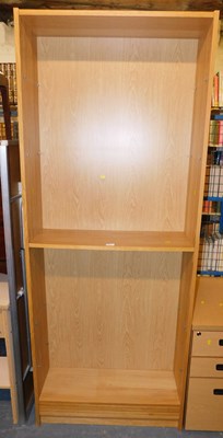 Lot 1142 - A pair of light oak laminate open bookcases,...