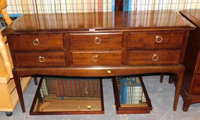 Lot 1147 - A Stag Minstrel dressing chest of six drawers,...