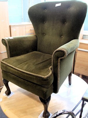 Lot 1551 - A green draylon upholstered armchair, on ball...