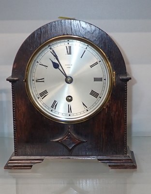 Lot 3007 - A Harrods of London 20thC oak cased mantel...