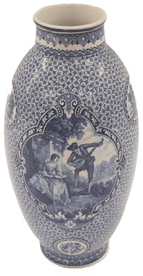 Lot 103 - A Continental blue printed pottery bullet...