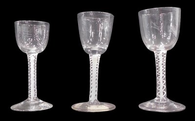 Lot 498 - Three 18thC wine glasses, with rounded funnel...