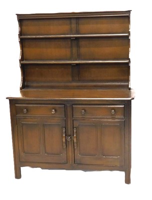 Lot 1145 - An Ercol dresser, the raised back with two...