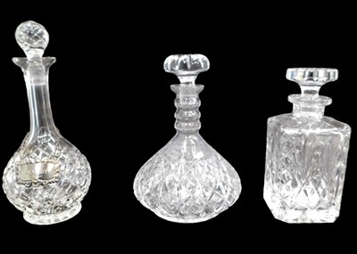 Lot 1254 - A cut glass triple ring neck decanter and...