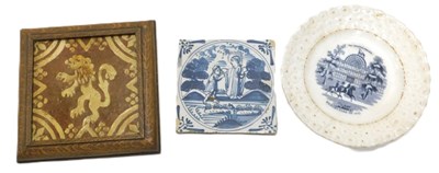 Lot 350 - A 17thC Delft tile in blue, with a Saint...