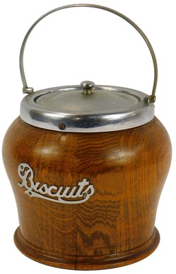 Lot 170 - A 20thC oak biscuit barrel, with metal mounts...