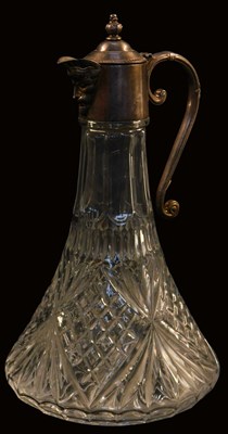 Lot 171 - A 20thC moulded glass claret jug, with metal...