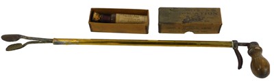 Lot 312 - A brass equine pill administrator, with cast...