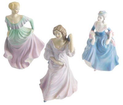 Lot 1135 - Three Coalport porcelain figurines, Stella,...