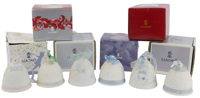 Lot 191 - Six Lladro bisque porcelain Christmas bells,...
