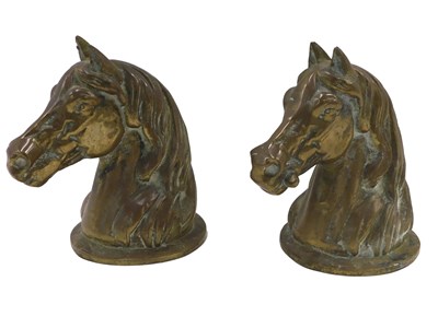 Lot 1138 - A pair of heavy brass sculpted horses head...