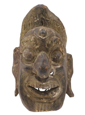 Lot 131 - A carved Nepalese tribal dance mask, 26cm high.