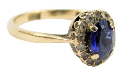 Lot 87 - A 9ct gold sapphire and white sapphire cluster...