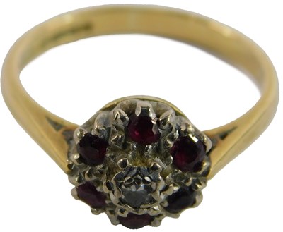 Lot 92 - An 18ct ruby and diamond cluster ring, size...