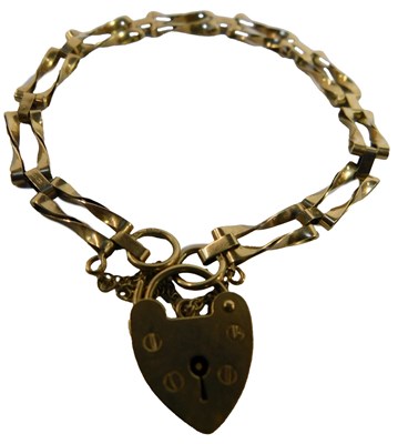Lot 100 - A 9ct gold bracelet, on a heart-shaped padlock...