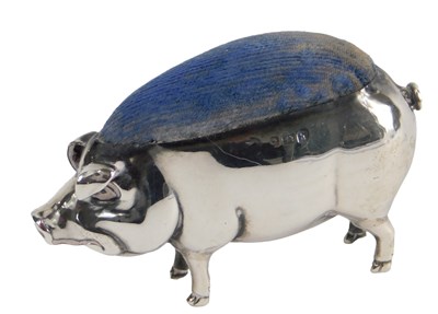 Lot 162 - An Edwardian silver pin cushion, modelled in...