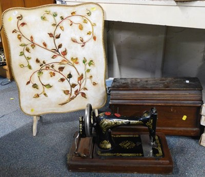 Lot 2010 - A small wooden firescreen, decorated with...