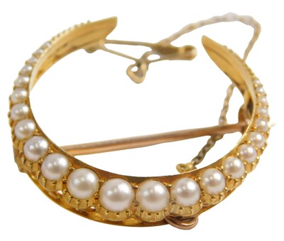 Lot 435 - An Edwardian seed pearl crescent moon...