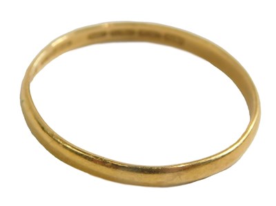 Lot 439 - A 22ct gold wedding band, of plain design,...