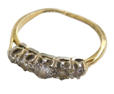 Lot 442 - An 18ct gold and platinum five stone dress...