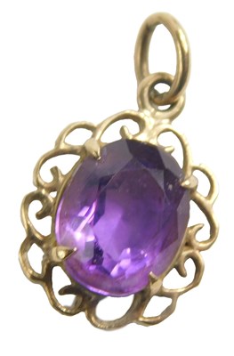 Lot 450 - A 9ct gold and amethyst pendant, formed as a...