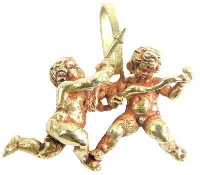 Lot 434 - An 18ct gold pendant, formed as two cherubs...