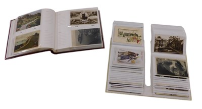 Lot 1172 - An album of early 20thC and later postcards,...
