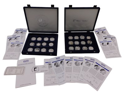 Lot 1263 - Twenty-four silver proof coins, to include the...