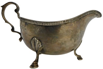 Lot 15 - An Elizabeth II silver sauce boat, with a line...